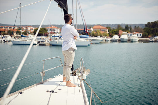 Casual attractive man sailing alone