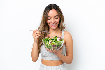 Young caucasian woman isolated on white background holding a bowl of salad with happy expression