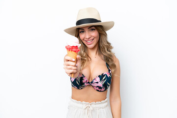 Girl wearing a swimsuit and holding cornet ice cream isolated on white background with happy expression