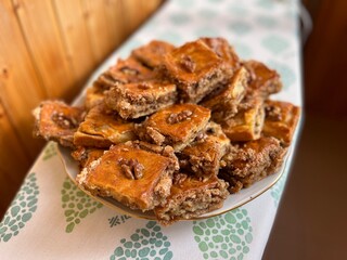 Pakhlava is a sweet of pastry, nuts and honey popular across the Caucasus, Middle East and eastern Mediterranean. Baclava is usually cut in the form of rectangles