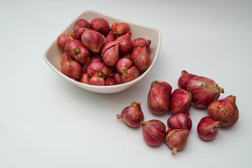 red onion in a bowl isolated on white background