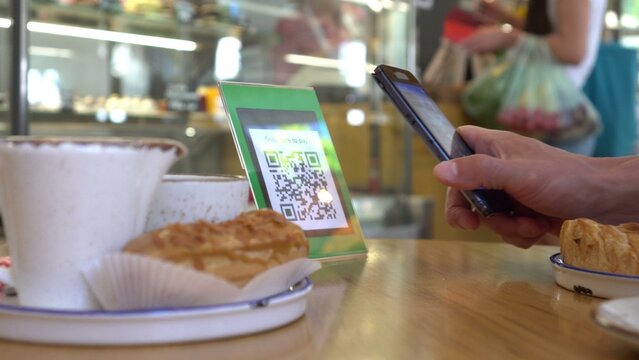 Smartphone scanning the recipients QR code. Mobile banking. Customers can pay through QR code, bank card, bank account or e wallet by using payment gate