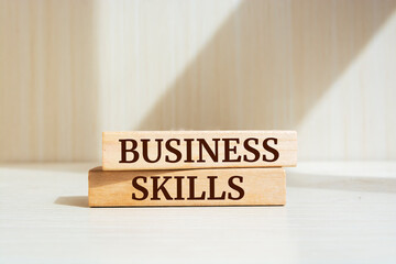 Wooden blocks with words 'BUSINESS SKILLS'. Business concept