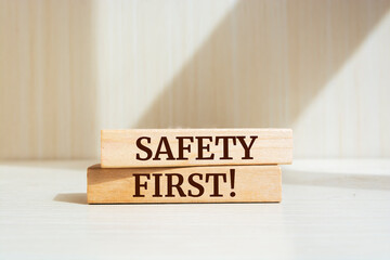 Wooden blocks with words 'Safety first'.