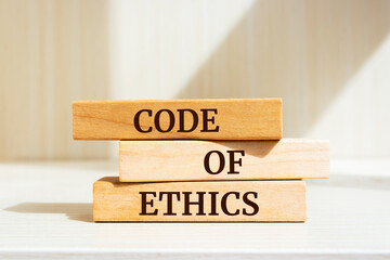 Wooden blocks with words 'Code of Ethics'. 