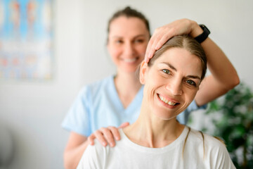 Modern rehabilitation physiotherapy woman worker with woman client