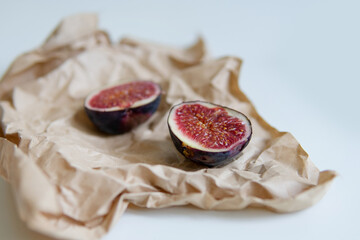 
cut figs on craft paper and light background.