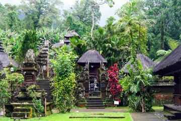 Fototapeta na wymiar Beautiful mystical atmospheric tropical forest landscape, old hindu jungle temple, misty sky - Pura Luhur Batukaru, Bali