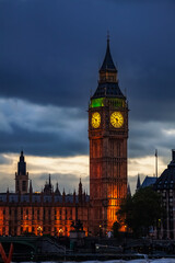 Fototapeta na wymiar Illuminated Palace of Westminster with Elizabeth Tower (Big Ben clock tower) at sunset, City of Westminster, Central Area of Greater London, UK