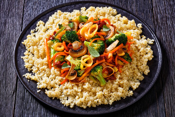 quinoa with fried veggies, mushrooms on plate