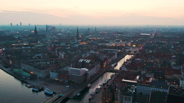 Drone shot over nyhavn channel copenhagen buildings. 60fps