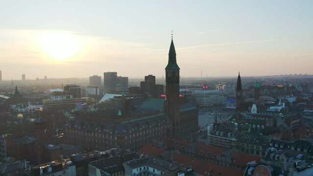 Drone panning left over copenhagen buildings and tower. 60fps