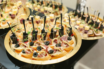 Festive buffet. Assortment of cold cuts and canapes. Reception at the party