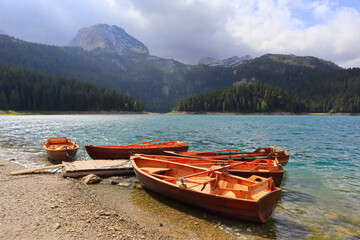 Boats on Black Lake in Durmitor National Park in Montenegro