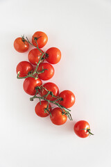 Fresh raw cherry tomatoes on white table. Top view