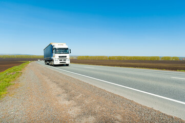 Fototapeta na wymiar Delivery by heavy vehicles. Logistics chains