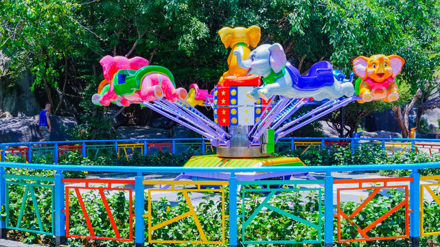 Children's attractions in the recreation park. Nha Trang city in Vietnam. Amusement Island on Vinpearl Island. 