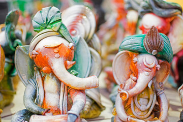Colorful dolls made of clay, Lord Ganesha, handicrafts on display during the Handicraft Fair in Kolkata , earlier Calcutta, West Bengal, India. It is the biggest handicrafts fair in Asia.