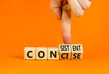 Concise or consistent symbol. Businessman turns wooden cubes and changes concept word Concise to...