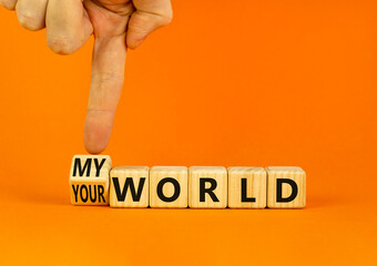 My or your world symbol. Businessman turns wooden cubes and changes concept words Your world to My world. Beautiful orange table orange background. Business and my or your world concept. Copy space.