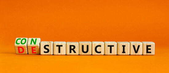 Destructive or constructive symbol. Turned wooden cubes and changed the concept word Destructive to...