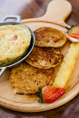 Delicious breakfast with egg and corn cake