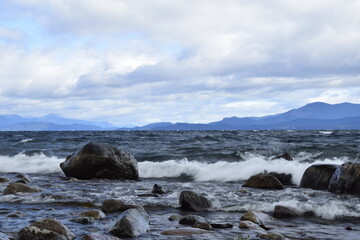 rocky shore of the Beautiful lakes in argentinian Lake District near Bariloche, Argentina