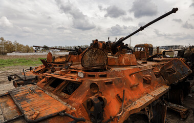 Fototapeta na wymiar Burnt and destroyed military armored vehicles