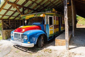 Soufriere, Saint Lucia, West Indies - Old local taxi bus in Morne Coubaril Historic Adventure Park....