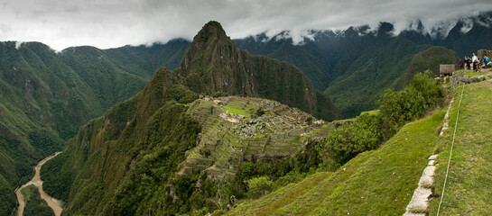 Ancient Inca lost city Machu Picchu landscape with clouds. Aguas calientes, Peru