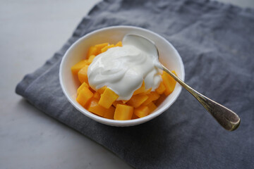 Ripe mango with homemade yogurt