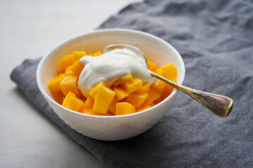 Ripe mango with homemade yogurt
