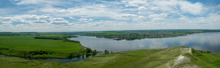 Sunny view on panorama of the Volga river. landscape with green hills and a river