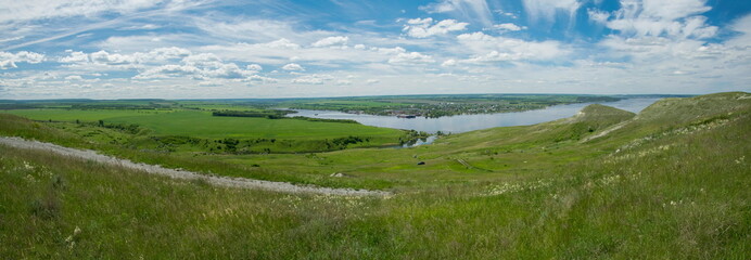 Sunny view on panorama of the Volga river. landscape with green hills and a river