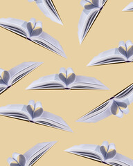 Flying books on a beige background. Pattern. Creative concept of World book day.