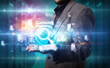 Businessman holding technology icon concept