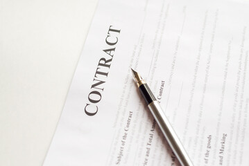 Business contract paper with fountain pen.