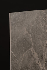 Porcelain tiles with a stone texture on a dark gray background