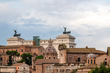 Obraz premium Panoramic view from the Roman Forum on the Victor Emmanuel II monument on Piazza Venezia in Rome (Roma), Lazio, Italy, EU Europe. Cityscape overlooking the church Santi Luca e Martina Via della Curia