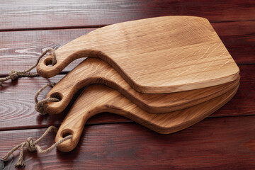 vintage cutting board on old wooden background, close-up