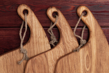 vintage cutting board on old wooden background, close-up