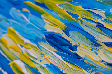 closeup of blue and yellow painting with brush strokes