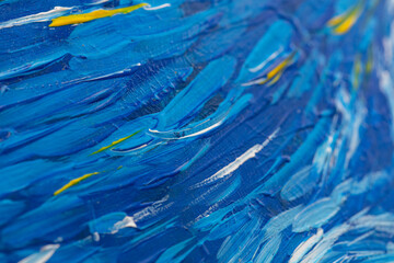 closeup of blue and yellow painting with brush strokes