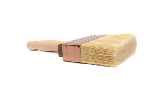 Canarian paletina brush N&ordm;3x10, with white and blonde synthetic bristles and varnished wooden handle. Suitable for any type of paint, including glues and adhesives. Isolated on white background.
