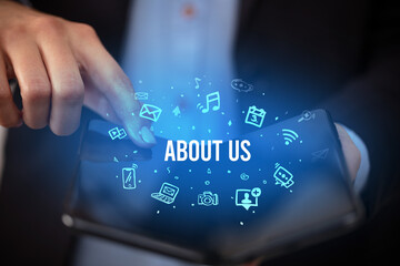 Businessman holding a foldable smartphone, social media concept