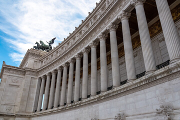 Fototapeta premium Massive columns of front facade of Victor Emmanuel II monument on Piazza Venezia in Rome (Roma), Lazio, Italy, EU Europe. Cityscape image of Altar of the Fatherland also know as Altare della Patria