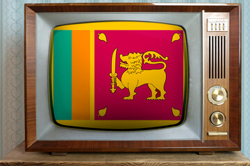 old tube vintage TV with the national flag of sri lanka on screen, stylish interior of the 60s, the...