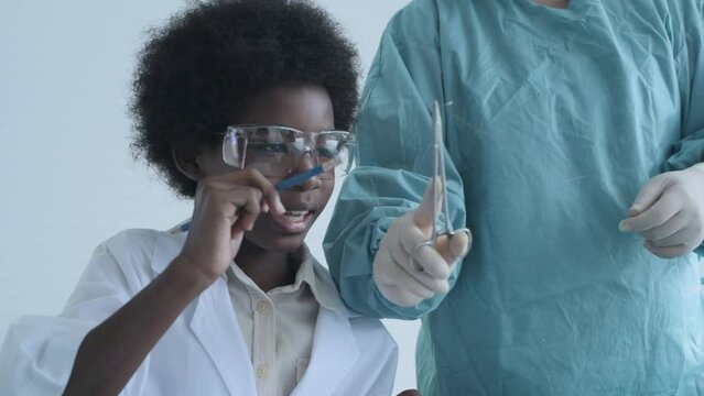 Education concept of 4k Resolution. Medical school students practicing suturing wounds in classroom. internship doctor. training simulation.
