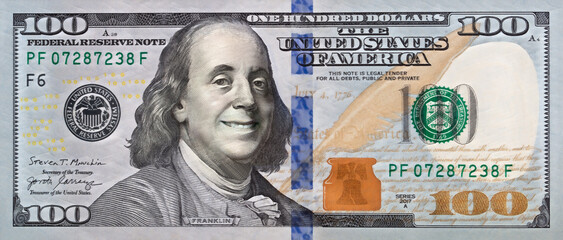 Benjamin Franklin smiling on 100 dollar banknote