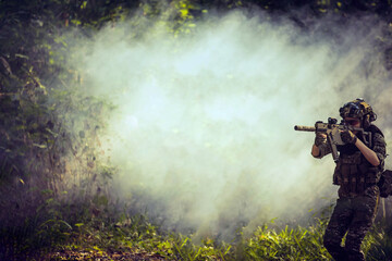 soldier with a rifle.Army soldier in protective uniform holding rifle .special forces soldier...